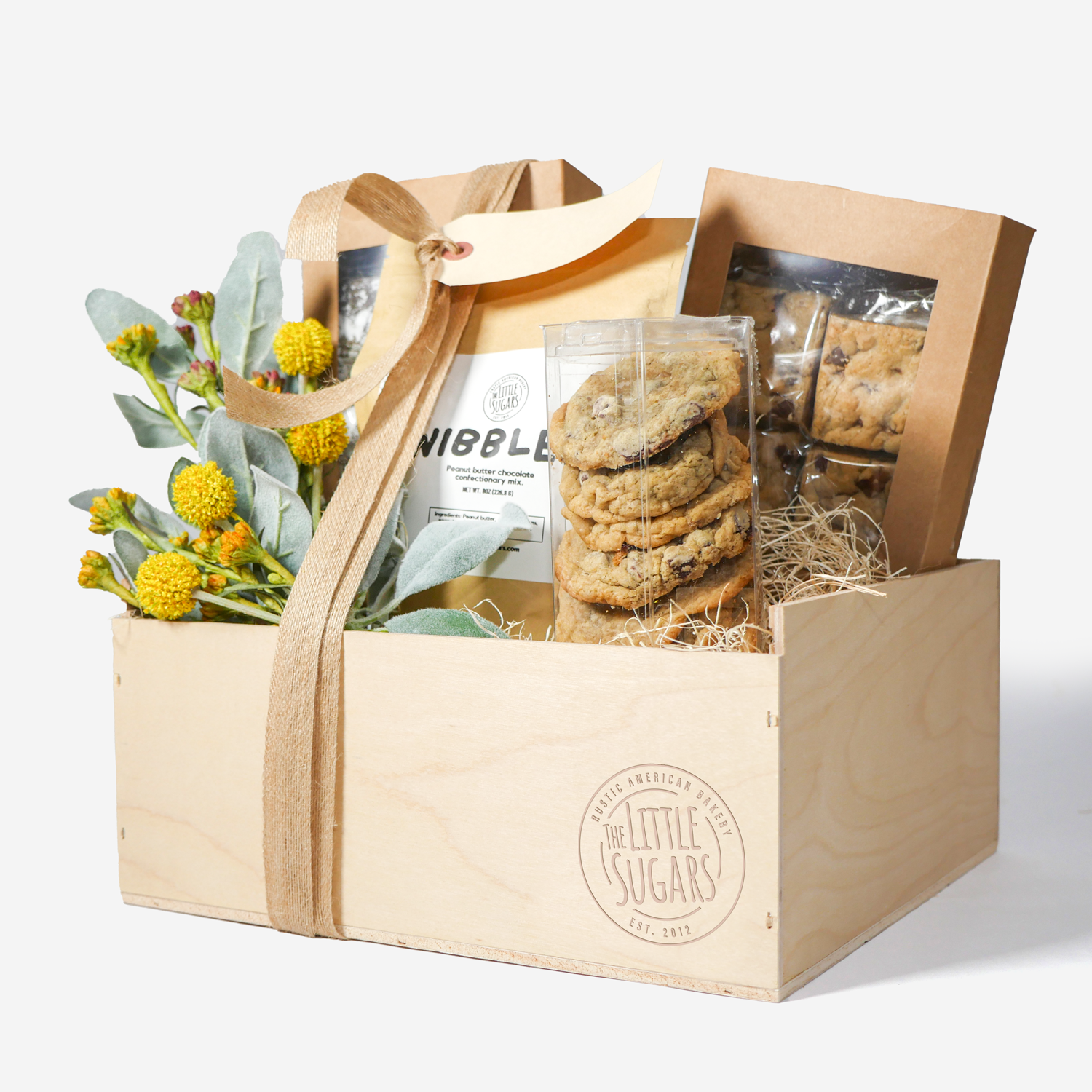 A wooden gift box filled with cookies and sweet treats from our Little Sugars chapter
